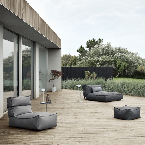 stay outdoor patio lounger stone  in a patio with outdoor furniture lifestyle