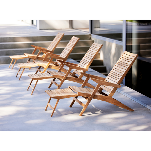 cane-line flip deck chair teak chair without cushion in a patio lifestyle