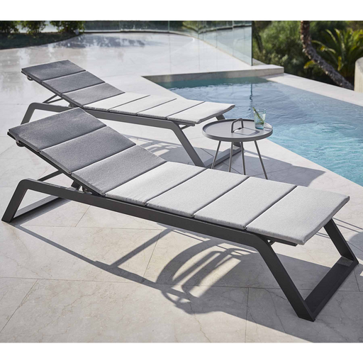 cane-line siesta sunbed Grey, Cane-line Tex sunbed with Light grey, Cane-line Virtue cushion in a pool lifestyle