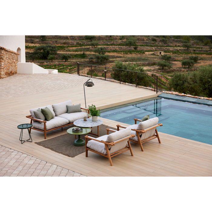 sticks 2 seater sofa Teak sofa Sand Cane-line Natté in a pool with outdoor furniture lifestyle