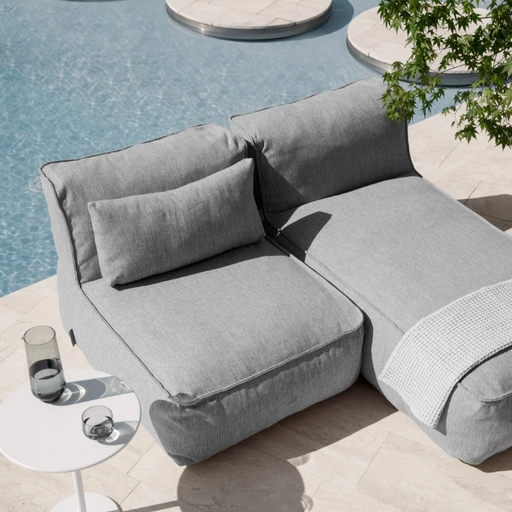 GROW Single Sectional Outdoor Patio Seat in a pool lifestyle