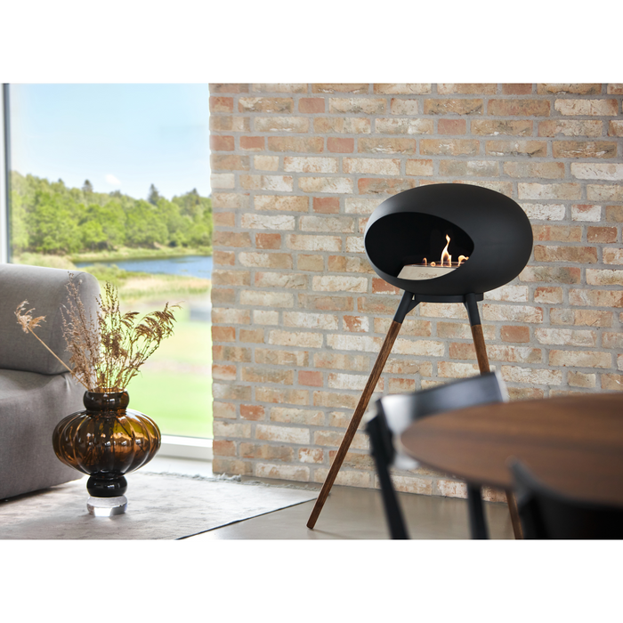 Le Feu Black Dome Bioethanol Fireplace ground high black bowl, smoked legs and steel burner indoor lifestyle