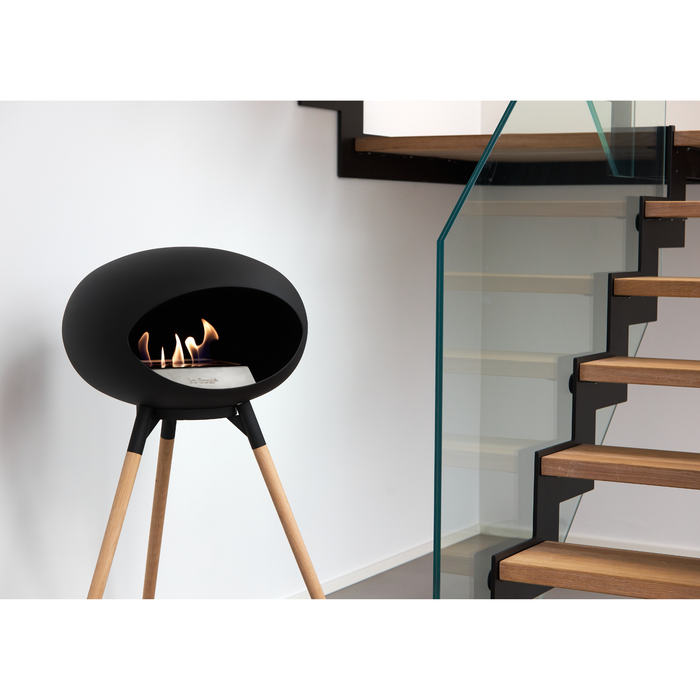 Le Feu Black Dome Bioethanol Fireplace ground high black bowl, soaptreated legs and steel burner indoor lifestyle
