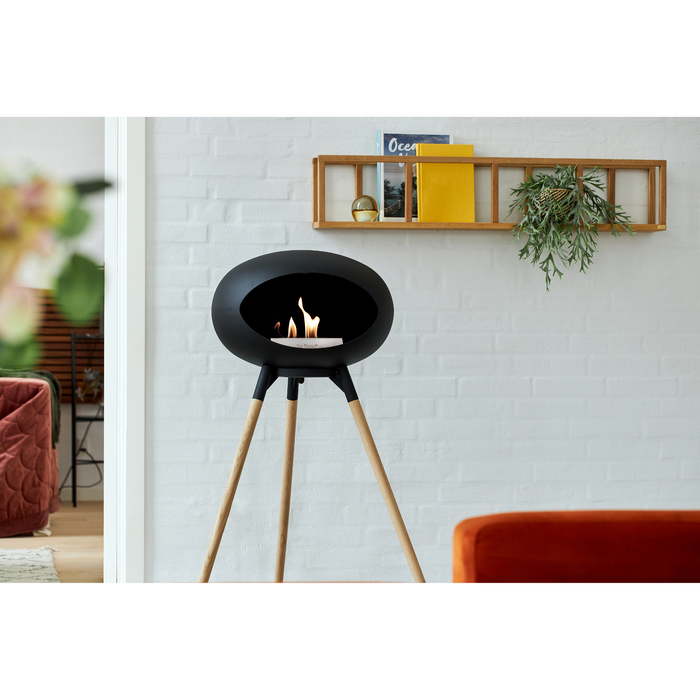 Le Feu Black Dome Bioethanol Fireplace ground high black bowl, soaptreated legs and steel burner indoor lifestyle