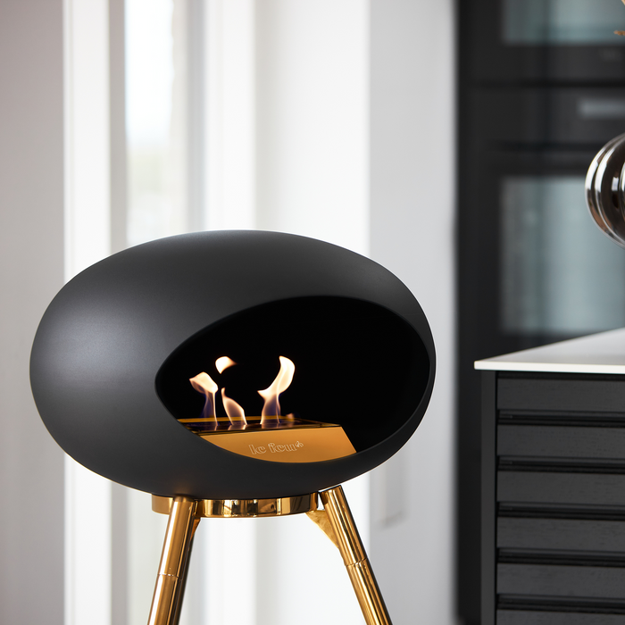 Le Feu Black Dome Bioethanol Fireplace ground high rose gold bowl, rose gold legs and rose gold burner indoor lifestyle