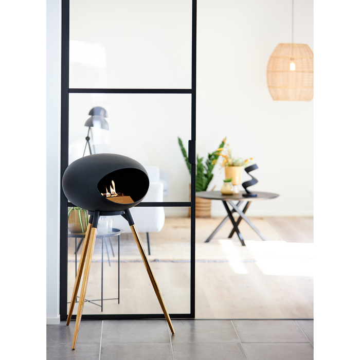 Le Feu Black Dome Bioethanol Fireplace ground high black bowl, rose gold legs and rose gold burner indoor lifestyle