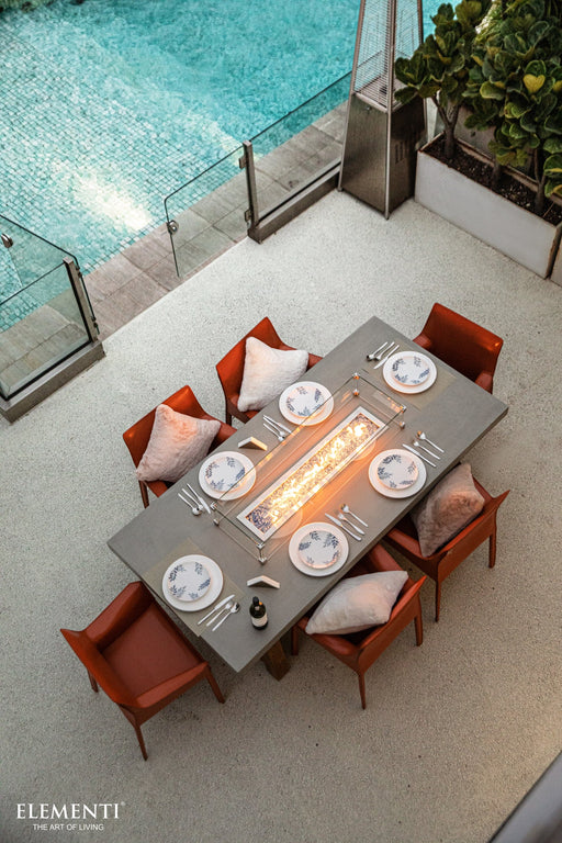 6 seater rectangular concrete dining table natural gas fire pit outdoor in a pool with outdoor furniture lifestyle