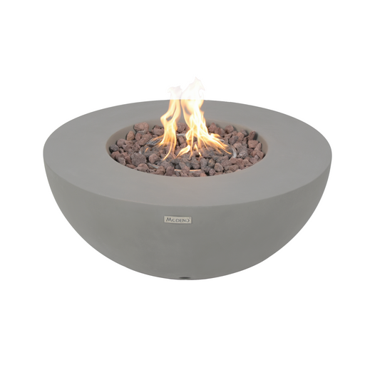 A gray Modeno Roca Fire Table with a visible flame, made from glass-fiber reinforced concrete, featuring a push-button spark ignition system and lava rocks inside.