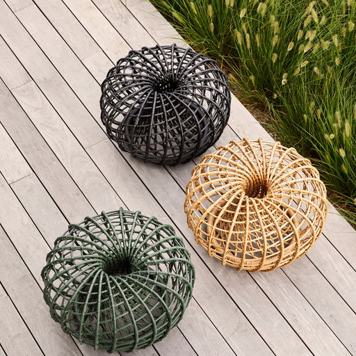 Cane line Nest coffee table footstool small all colors  in a patio lifestyle