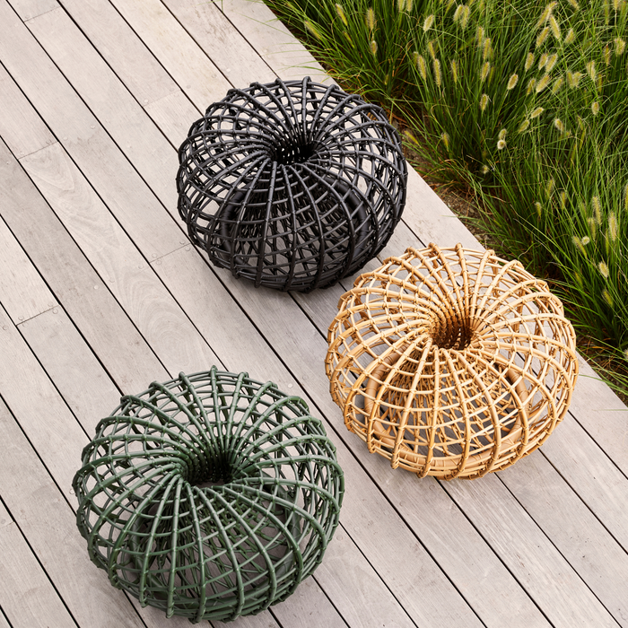 Cane line Nest coffee table footstool small all colors  in a patio lifestyle