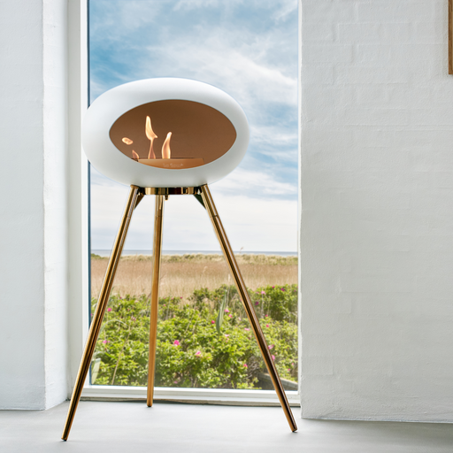 Le Feu White Dome Bioethanol Fireplace ground high rose gold bowl, rose gold legs and rose gold burner indoor lifestyle
