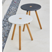 lifestyle image of cane-line area table stool in Teak w/Lava Grey Aluminium and cane-line area table stool in Teak w/White Aluminium in a patio