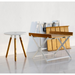 lifestyle image of cane-line area table stool in Teak w/White Aluminium in a room with table