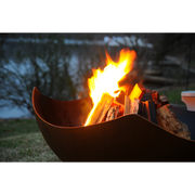 Fire pit art outdoor Asia 60" fire pit stainless steel with wood in a lake lifestyle