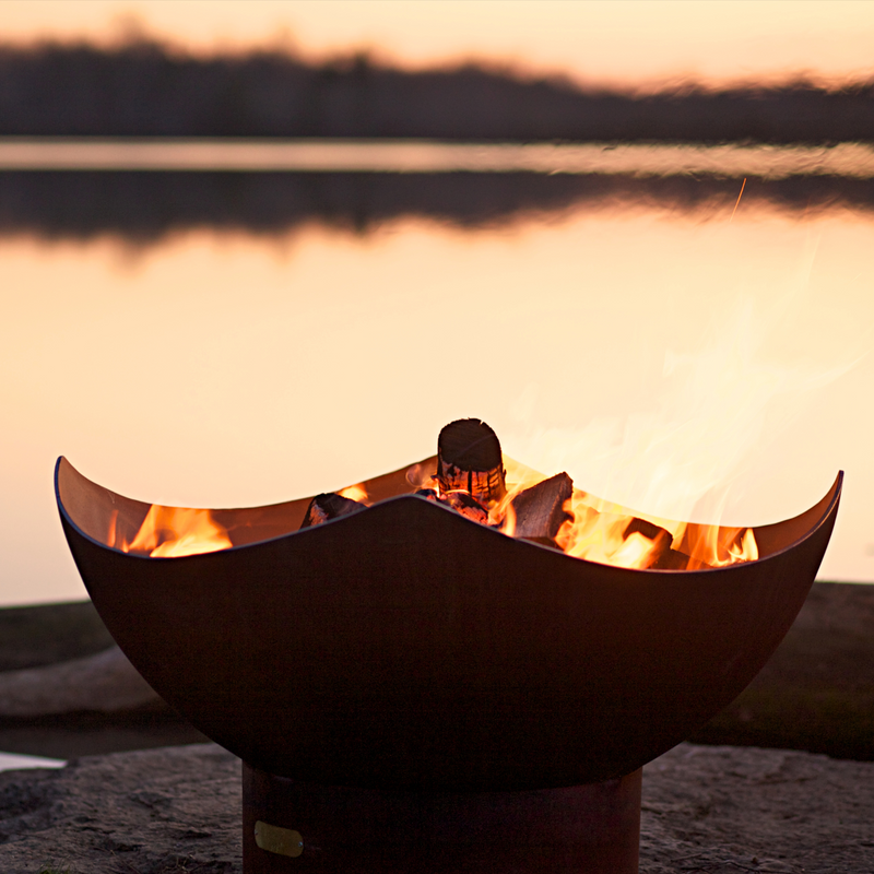 Fire pit art outdoor Manta Ray fire pit stainless steel with wood in a lake lifestyle