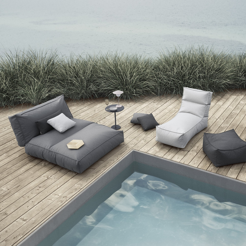 stay outdoor pouf patio lounger stone cloud in a pool with outdoor furniture lifestyle
