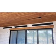 Wooden ceiling with rad tec mounted heater above a glass door.