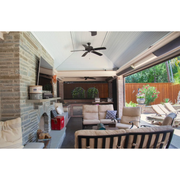 Luxury covered outdoor living space with mounted RADtec zero light patio heaters, fireplace, and lounge seating