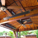 Tropical bamboo patio ceiling with mounted RADtec zero light infrared heaters and ceiling fans for outdoor comfort