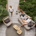 lifestyle image of cane-line royal coffee table in teak square and cane-line royal coffee table in teak rectangular in a patio and a man enjoying a sofa