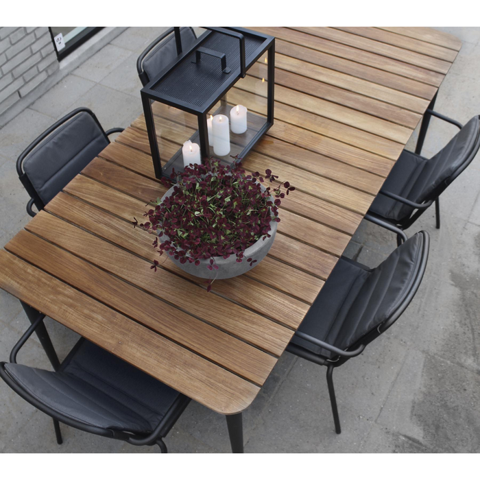 cane-line core dining table 82.7" x 35.5" Lava Grey, Aluminium w/Teak table in a patio with dining chairs lifestyle