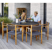 cane line aspect round dining  table dia 56 smokey black lifestyle with dining chairs
