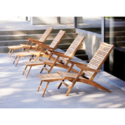 cane-line flip deck chair teak chair without cushion in a patio lifestyle