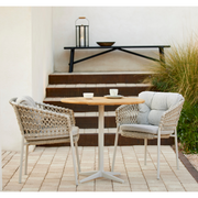 cane-line ocean chair Sand, Open Cane-line Soft Rope chair with Light Grey, Cane-line Natté cushion in a patio with table lifestyle