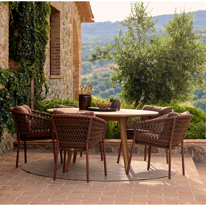 cane-line ocean chair Umber Brown, Open Cane-line Soft Rope chair with Umber Brown, Cane-line Rise cushion in a patio with round dining table lifestyle