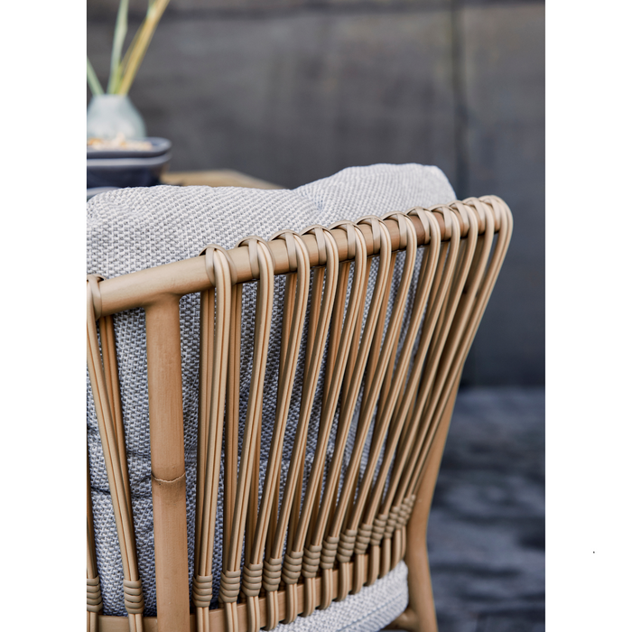 cane-line ocean chair Natural, Medium Round Tube Cane-line Weave chair with Taupe, Cane-line Natté cushion in a patio close up texture lifestyle