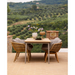 cane-line stay chair with teak swivel natural chair with dining table in a patio lifestyle