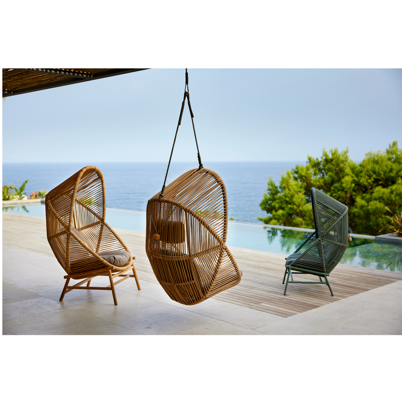 cane line hive chair all colors and base and soft rope in a patio with a pool lifestyle