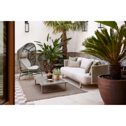 cane line hive chair Dusty green, small round tube Cane-line Weave with Dusty green, aluminium base and Sand, Cane-line AirTouch cushion in a patio with outdoor furniure lifestyle