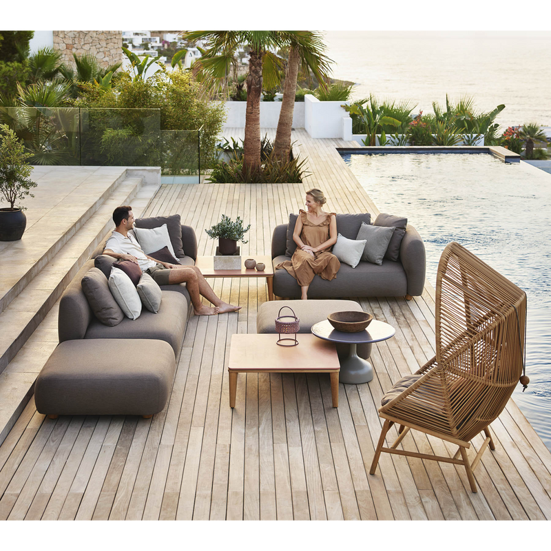 cane line hive chair Natural, small round tube Cane-line Weave with Teak base and Light brown, Cane-line Rise cushion in a patio with outdoor furniture lifestyle