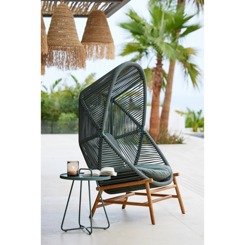 cane line hive chair Dusty green, small round tube Cane-line Weave with teak base and Light green, Cane-line Link cushion in a patio lifestyle