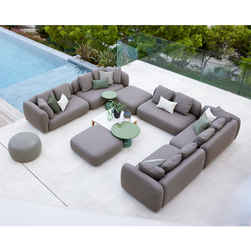 cane-line capture pouf taupe, cane-line airtouch pouf in a patio with pool and outdoor furniture lifestyle