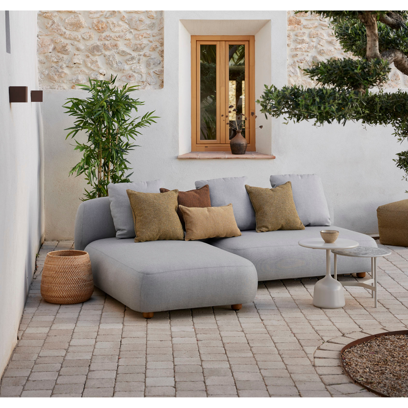 cane-line capture 2 seater sofa module light grey, cane-line airtouch in a patio with outdoor furniture lifestyle