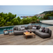 cane-line capture 2 seater sofa module taupe, cane-line airtouch sofa in a patio with pool and outdoor furniture lifestyle