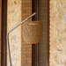 cane-line illusion glow lamp hanging natural with taupe base in a patio lifestyle