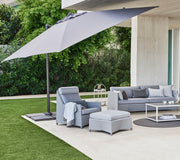 cane line hyde luxe tilt parasol 118 x 118 lifestyle open parasol with outdoor furniture