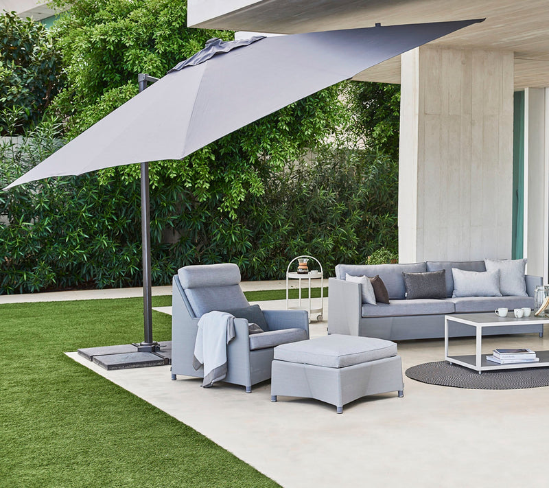 cane line hyde luxe tilt parasol 118 x 118 lifestyle open parasol with outdoor furniture