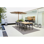 cane line classic parasol w/pulley system lifestyle with dining table