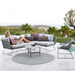 cane-line circle rug 55 taupe soft rope in a patio with pool and outdoor furniture and a woman enjoying a sofa lifestyle