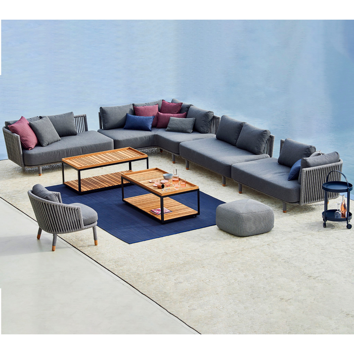 cane-line moments 2 seater sofa left module Grey, String Open Cane-line Soft Rope Incl. Grey Cane-line AirTouch cushion in a patio with pool and outdoor furniture lifestyle