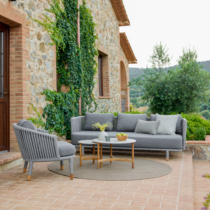 cane-line moments 3 seater sofa Grey, String Open Cane-line Soft Rope Incl. Grey Cane-line AirTouch in a patio with moments lounge chair and outdoor furniture lifestyle