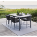 cane-line dot rug 94 x 66 multi colour soft rope in a patio with dining table and chair lifestyle