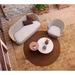 cane-line knit rug 78 umber brown soft rope in a patio with outdoor furniture lifestyle