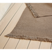 cane-line knit rug 94 x 66 dark sand soft rope in a patio close up lifestyle