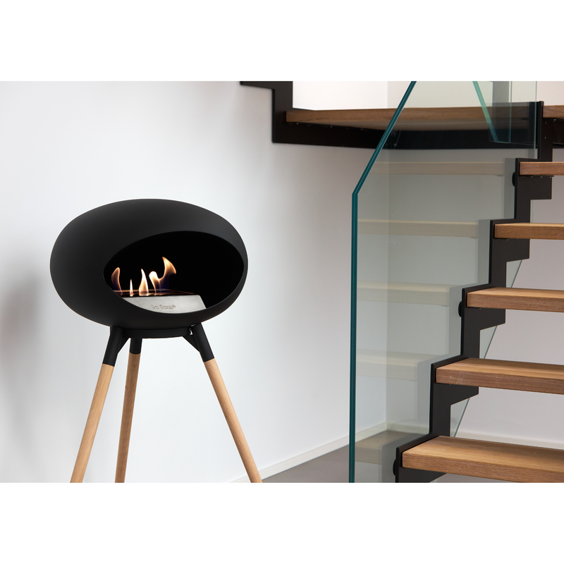 Le Feu Black Dome Bioethanol Fireplace ground high black bowl, soaptreated legs and steel burner indoor lifestyle