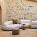 lifestyle image of cane-line circle footstool small in Taupe, Swirl Cane-line Soft Rope in a patio with mellow sofa and outdoor furniture